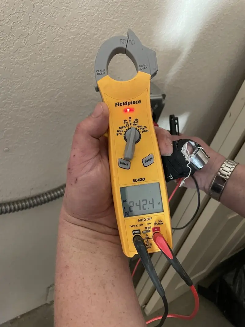 Voltage testing with clamp meter during Recessed Lighting Installation in Memphis